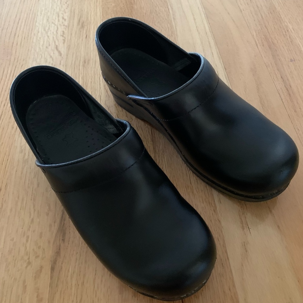 Dansko black leather clogs
